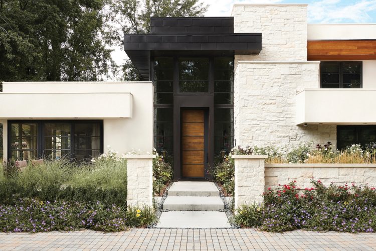 A rift oak door with blackened steel on a home in Cherry Creek.