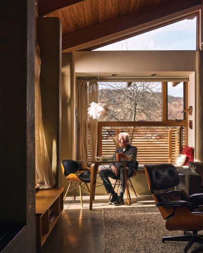 Boulder architect David Barrett sits in a home of his design.