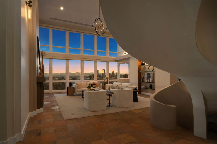 A sculptural staircase sets the tone when entering the penthouse, where walls of glass frame welcome you with an unforgettable panorama of Denver’s cityscape.