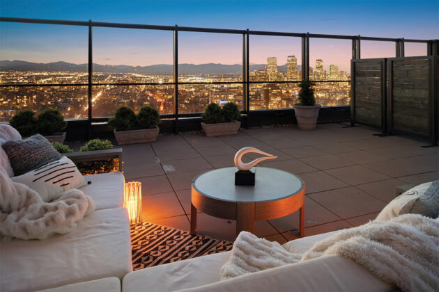 The private rooftop terrace offers a breathtaking one-of-a-kind vantage point in Denver, where the skyline, Cheesman Park, and the Rockies unfold in every direction.