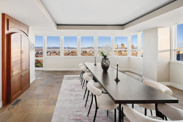 Light-filled and refined, the dining room offers an elegant setting for entertaining above the city and overlooking Cheesman Park.