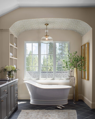 Bathtub in front of large windows in the 2026 Home & Garden Colorado Designer Showhouse.