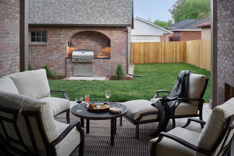 Patio set and grill in the backyard in the 2026 Home & Garden Colorado Designer Showhouse.