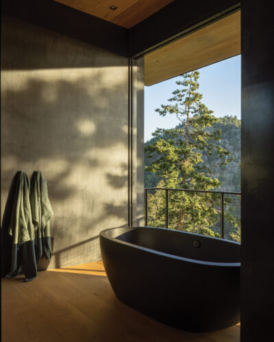 Bathroom with bathtub in the home by Follow Architecture.