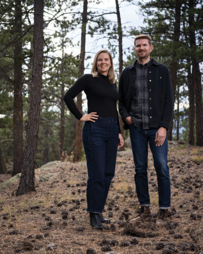Andrea and Colin Ostman of Follow Architecture pose in the woods.