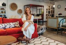 The Refinery Brings New Life to Consignment Furniture in Boulder Paula Minnis, founder of The Refinery in Boulder, Colorado, sits on a bright red sofa surrounded by consignment furniture, vintage décor, artwork, and globally inspired home furnishings.